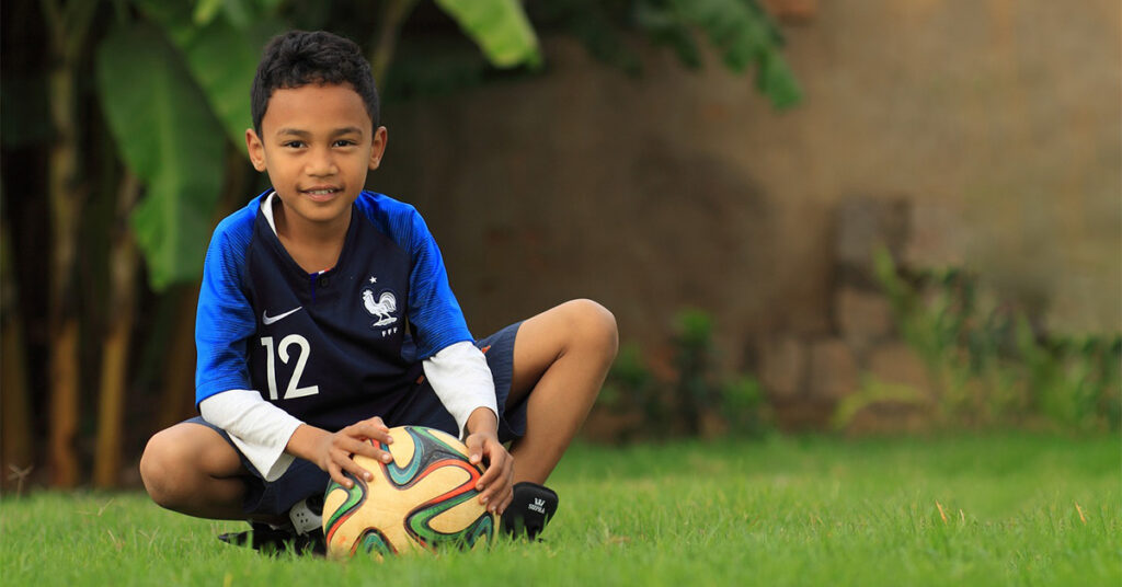 Kid soccer football player